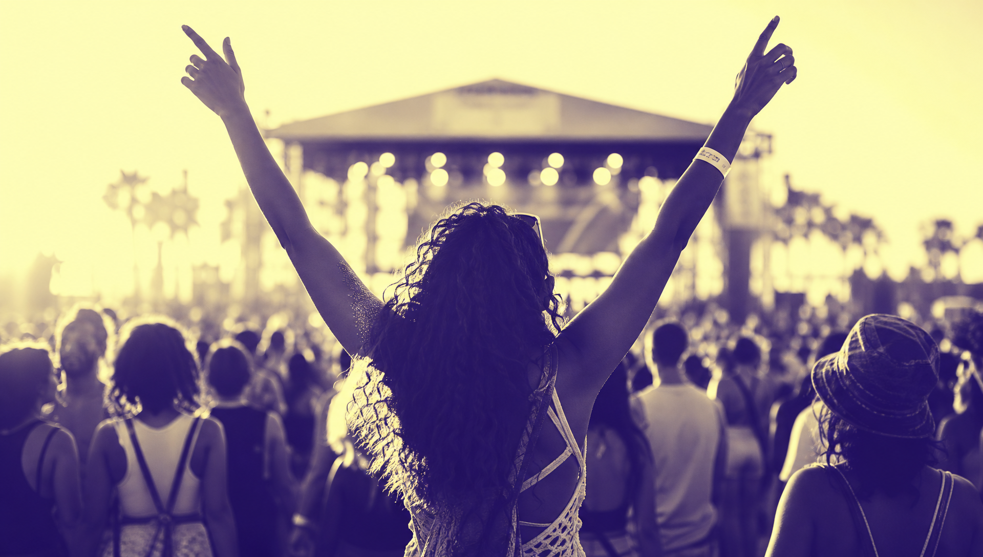 Crowd with hands raised during an interactive Chaos Theory activation