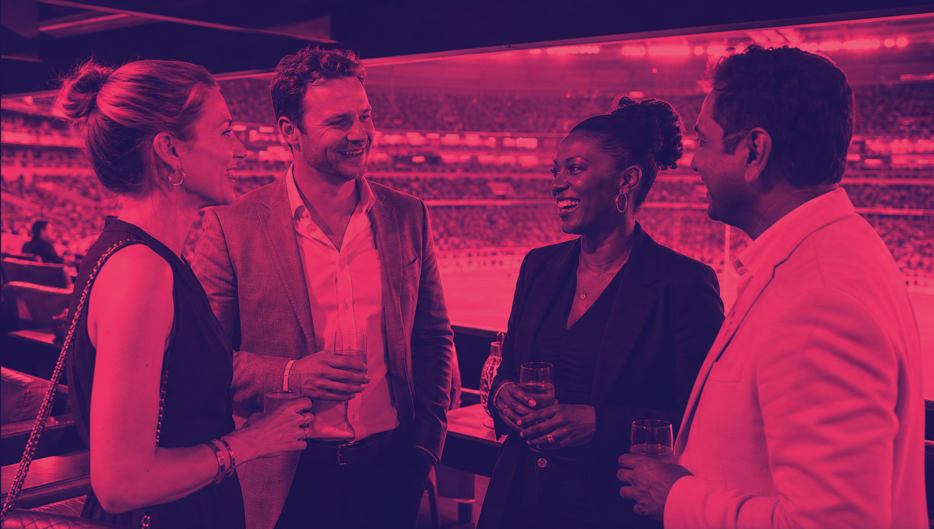 Mixed guests enjoying premium sports hospitality during a live event in Chaos Theory duotone