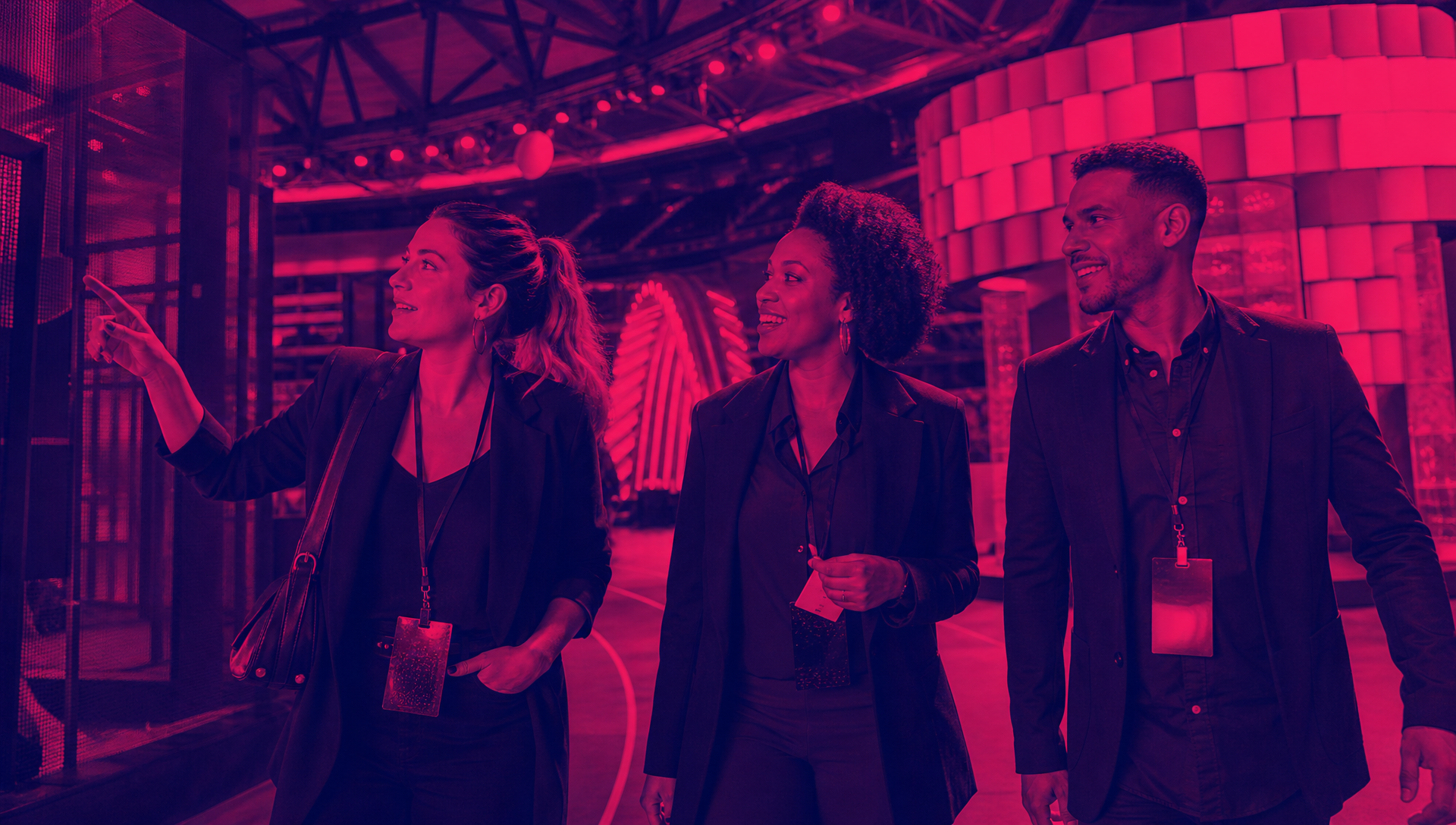 Guests moving through a contemporary sports activation environment in deep purple and hot pink duotone